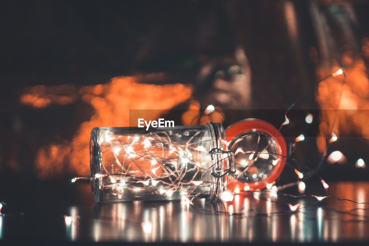 Close-up of illuminated lights in jar