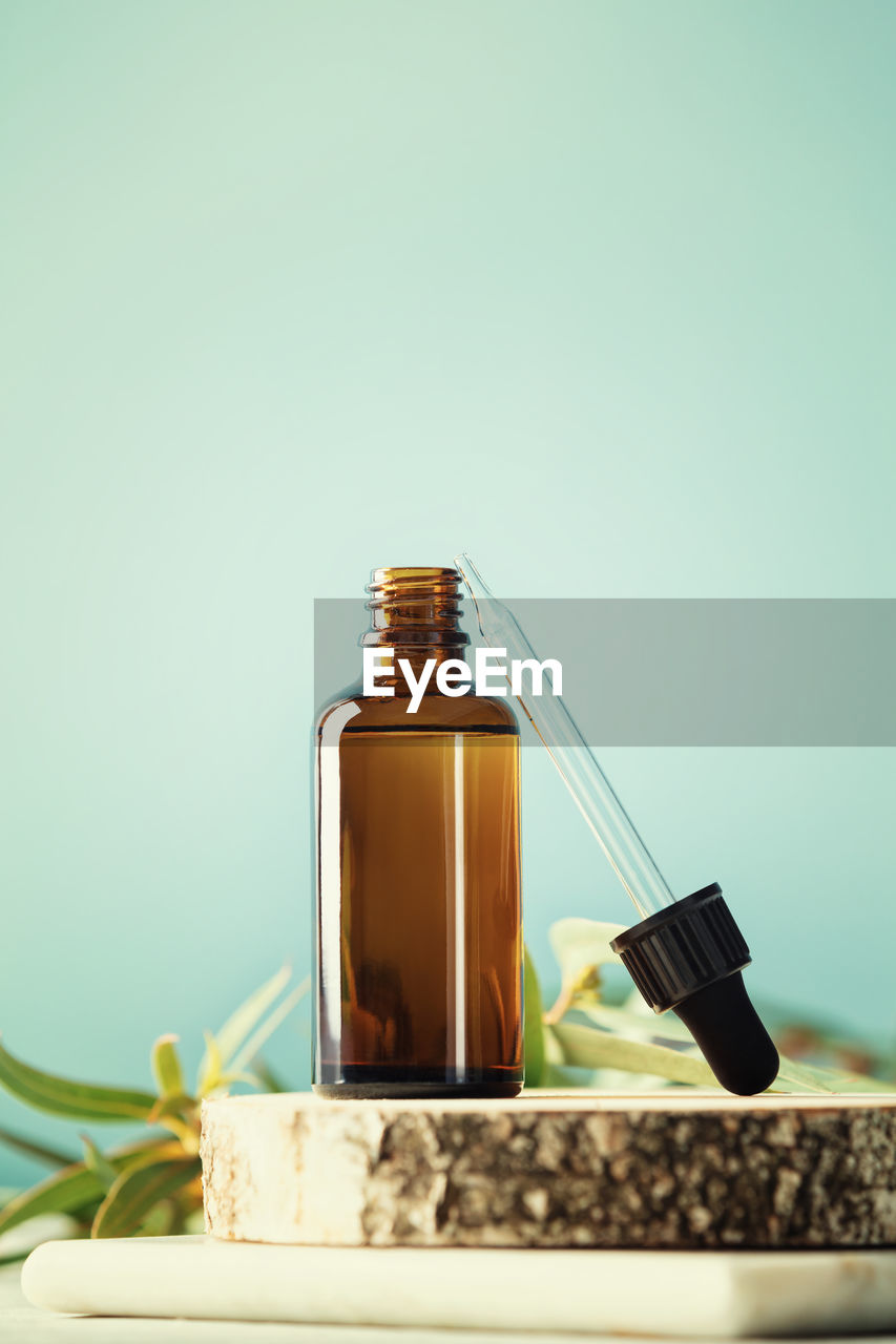 Close-up of drink in jar against white background