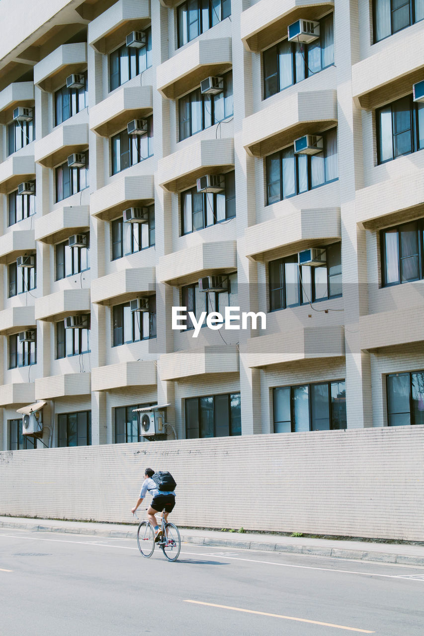 Man riding bicycle in city