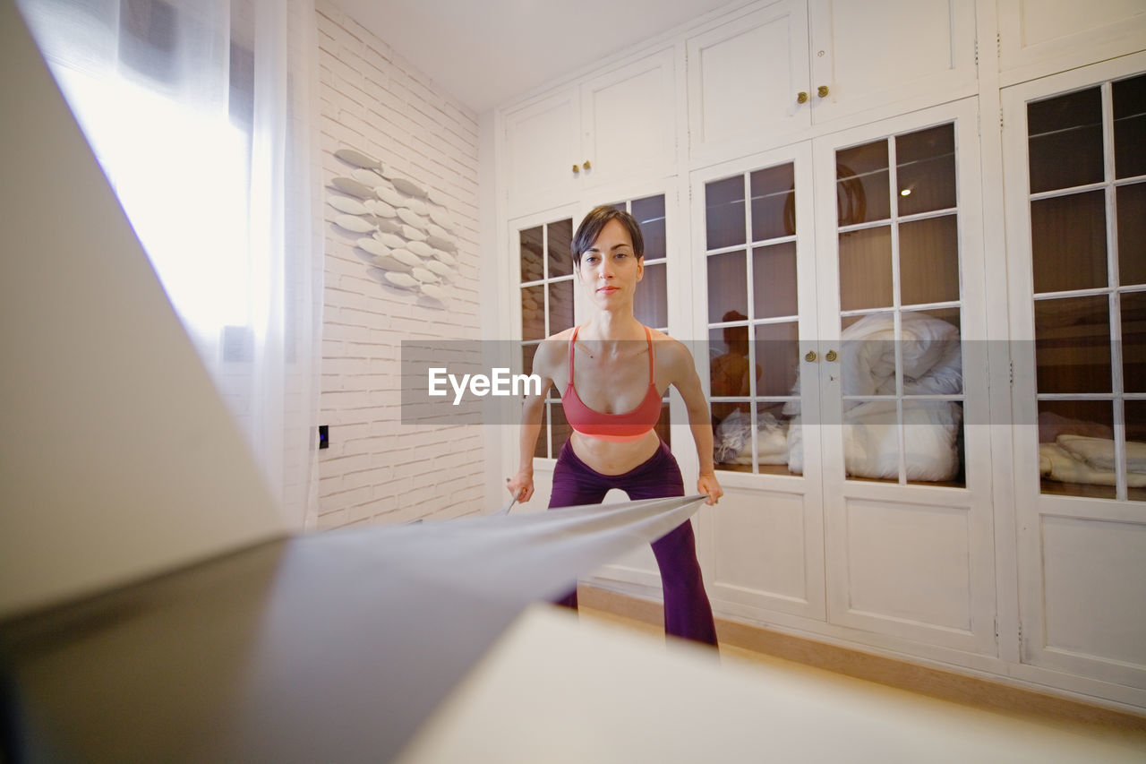 Woman exercising at home