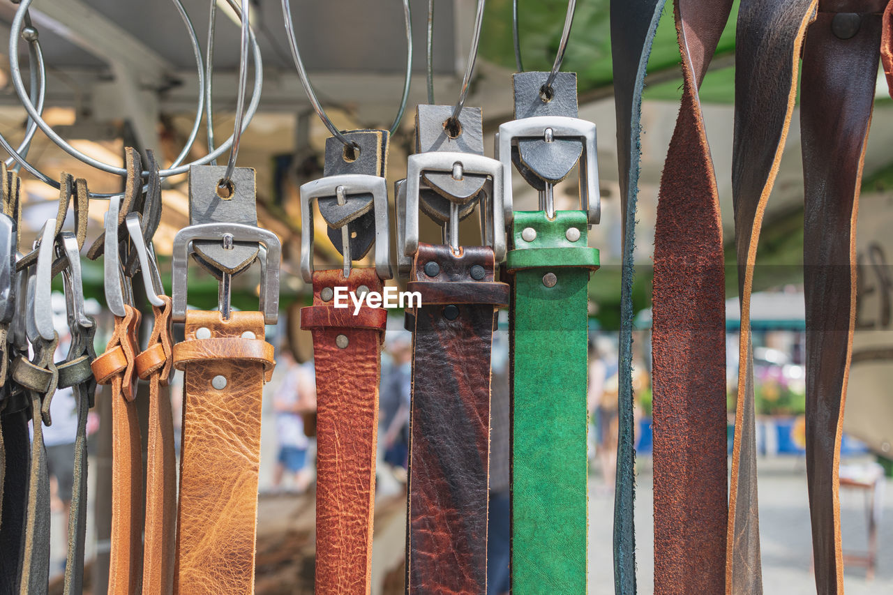 CLOSE-UP OF CLOTHES HANGING AT MARKET