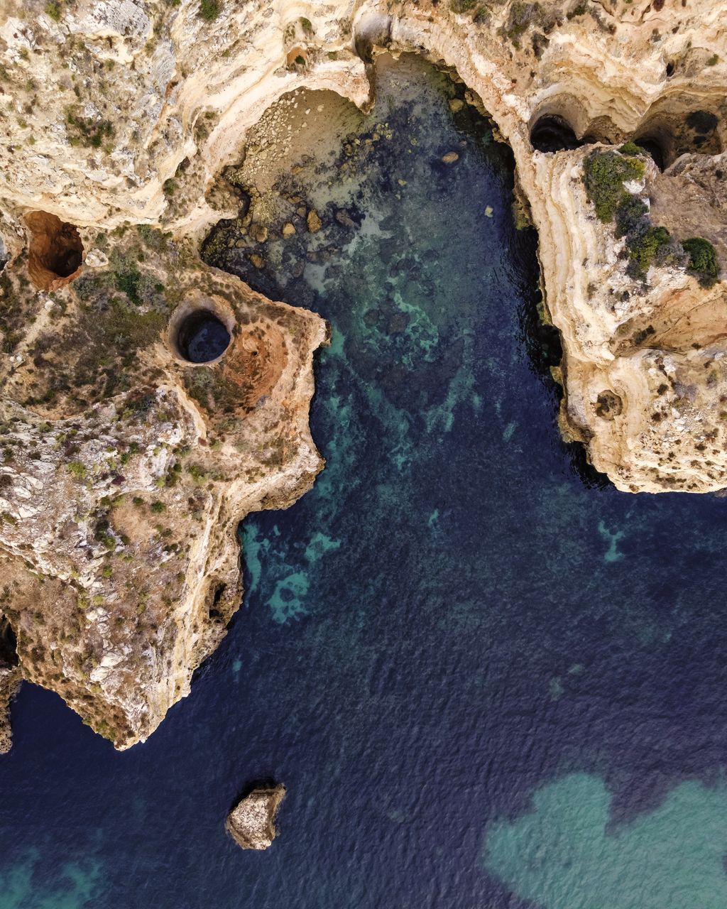 Aerial view of coastline by sea