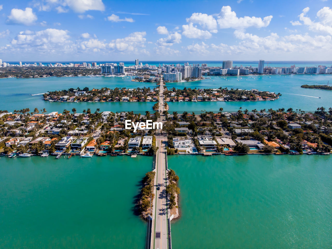 Aerial view of city and sea against sky