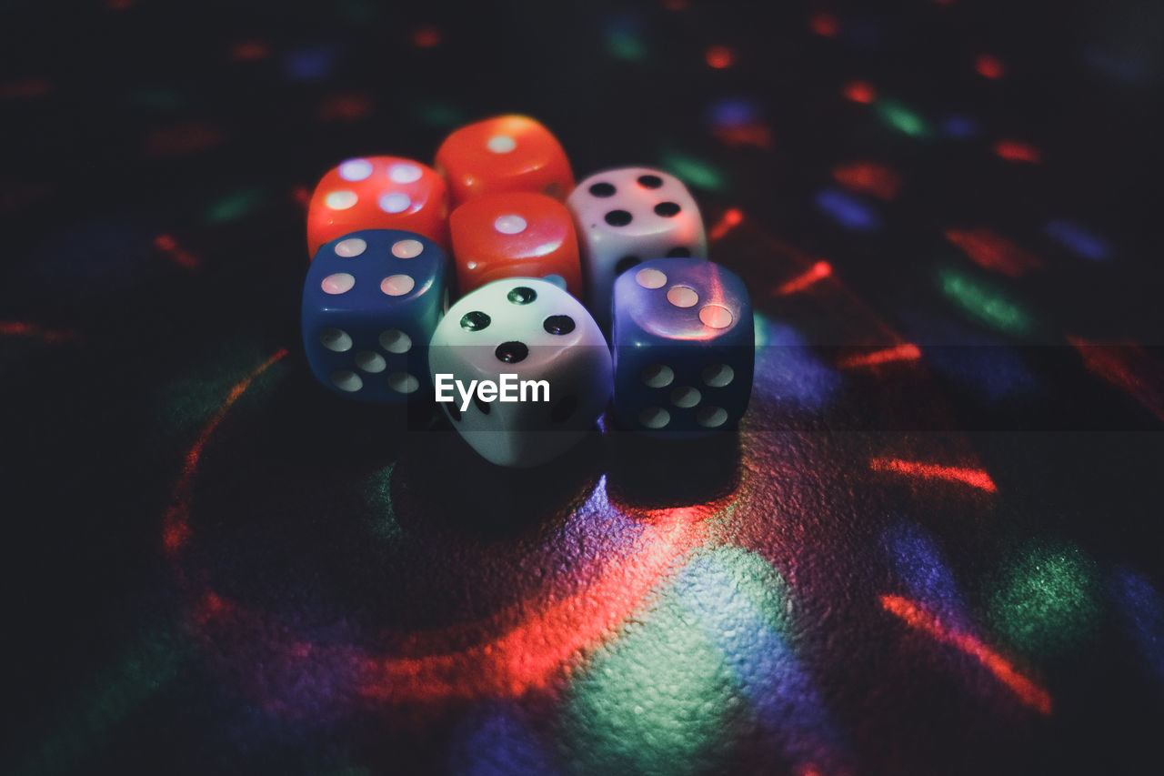 Colourful dice with lots of lighting effect gambling concept