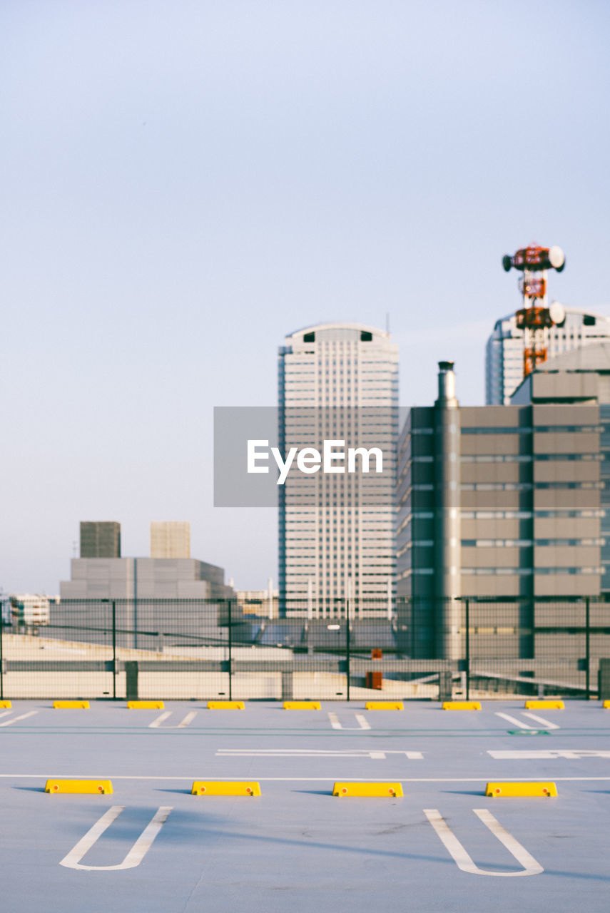 MODERN BUILDINGS AGAINST CLEAR SKY