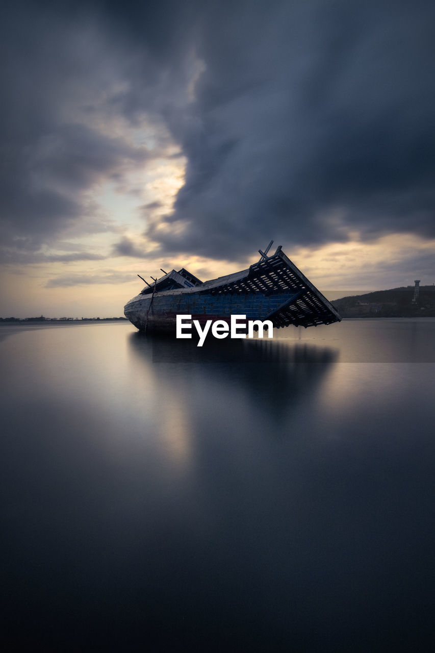 Stuck boat during low tide in the harbor