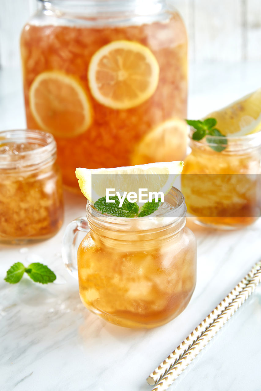 Close-up of fruits in glass jar on table