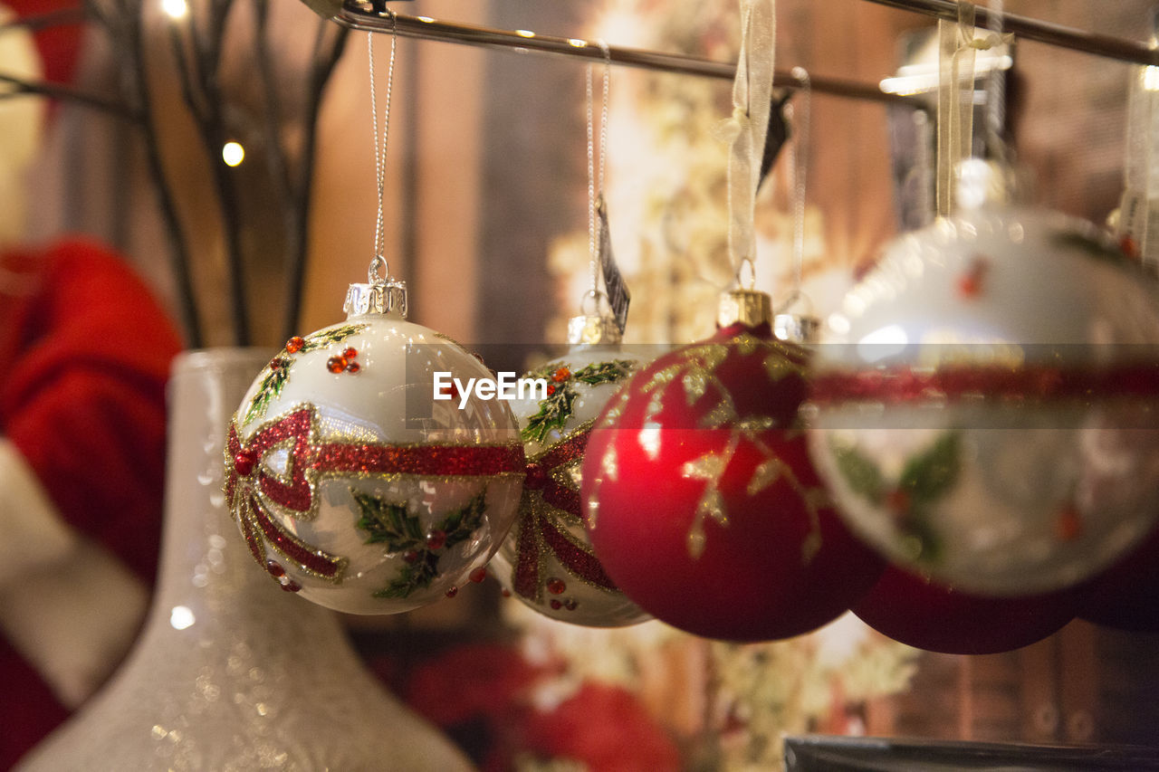 Close-up of christmas ornaments hanging at store