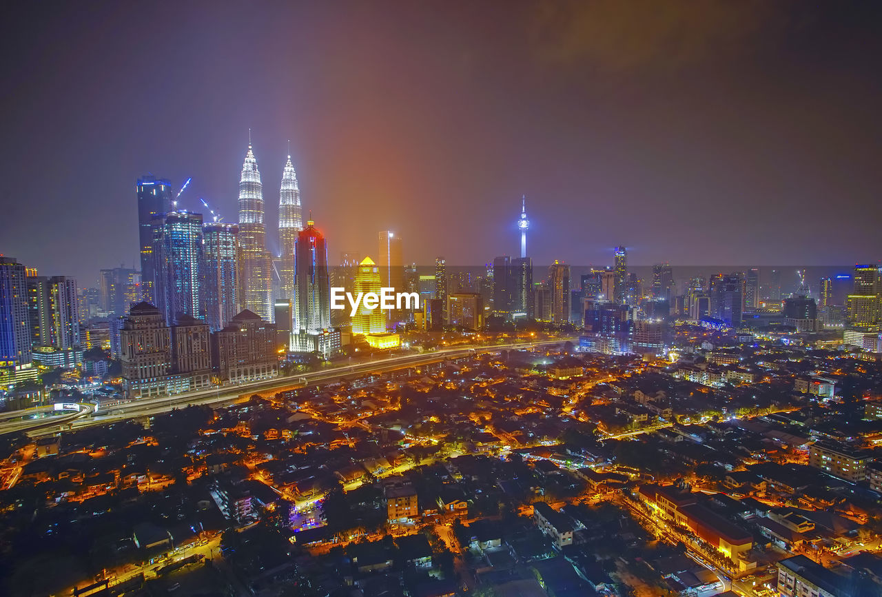 Illuminated buildings in city at night