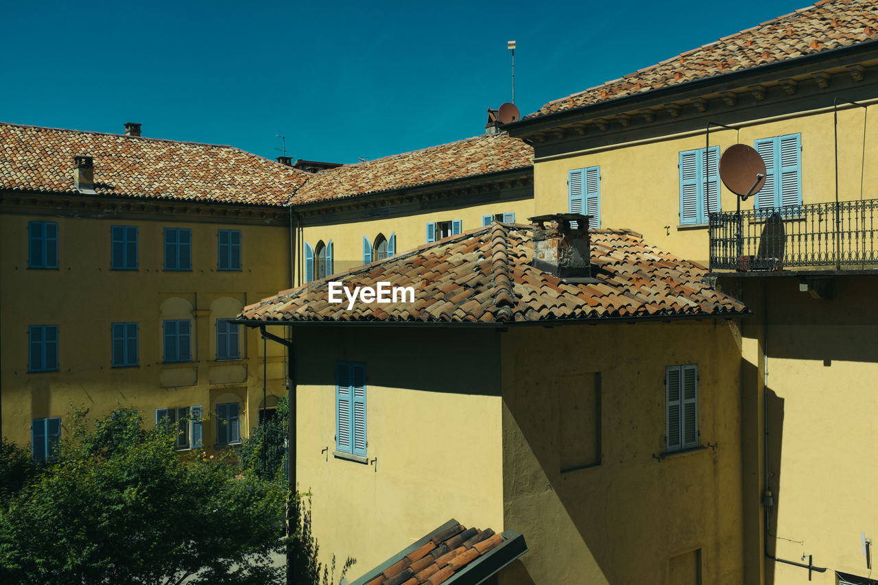 HOUSES AGAINST THE SKY