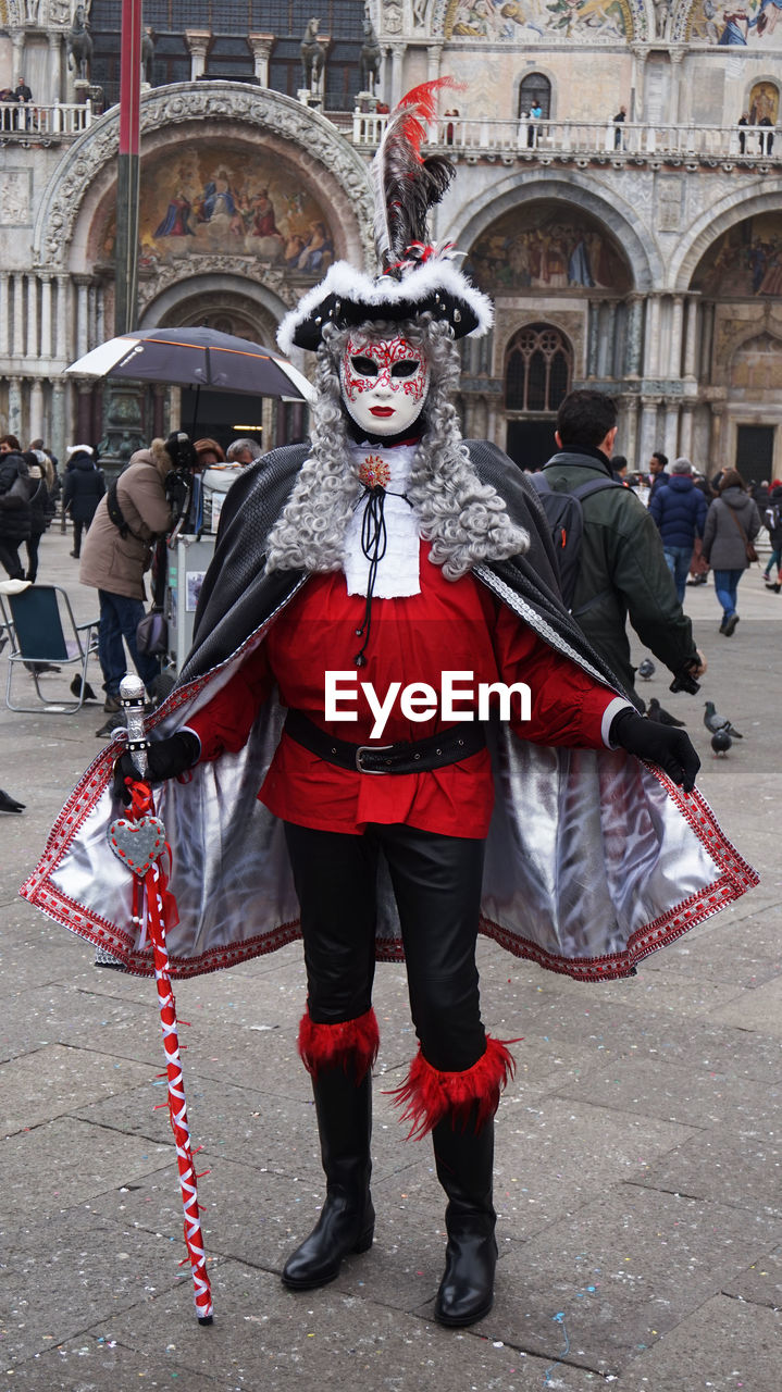 FULL LENGTH PORTRAIT OF MAN STANDING ON TRADITIONAL CLOTHING