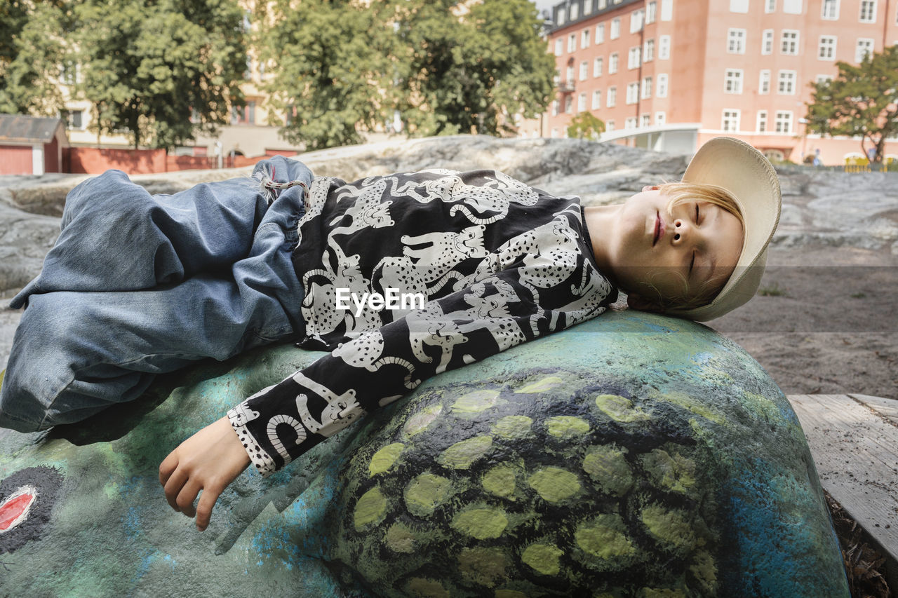 Girl lying on rock