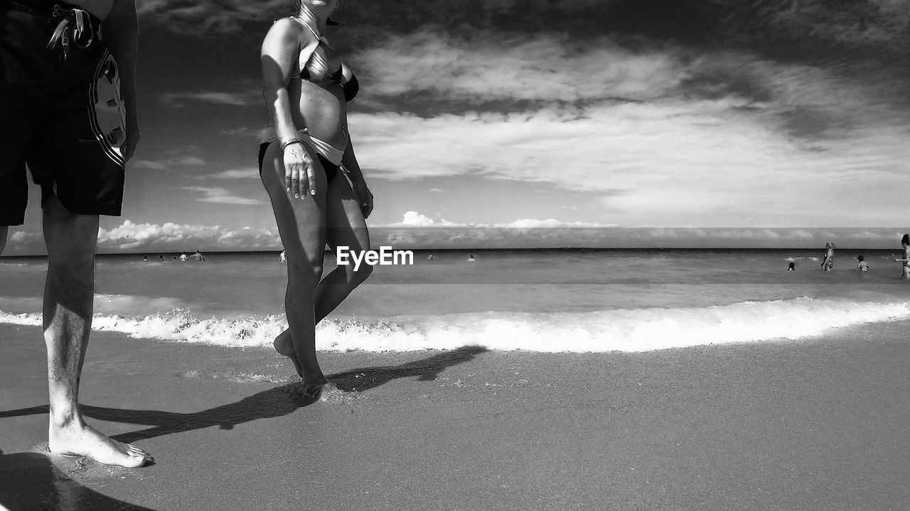 PEOPLE ENJOYING ON BEACH