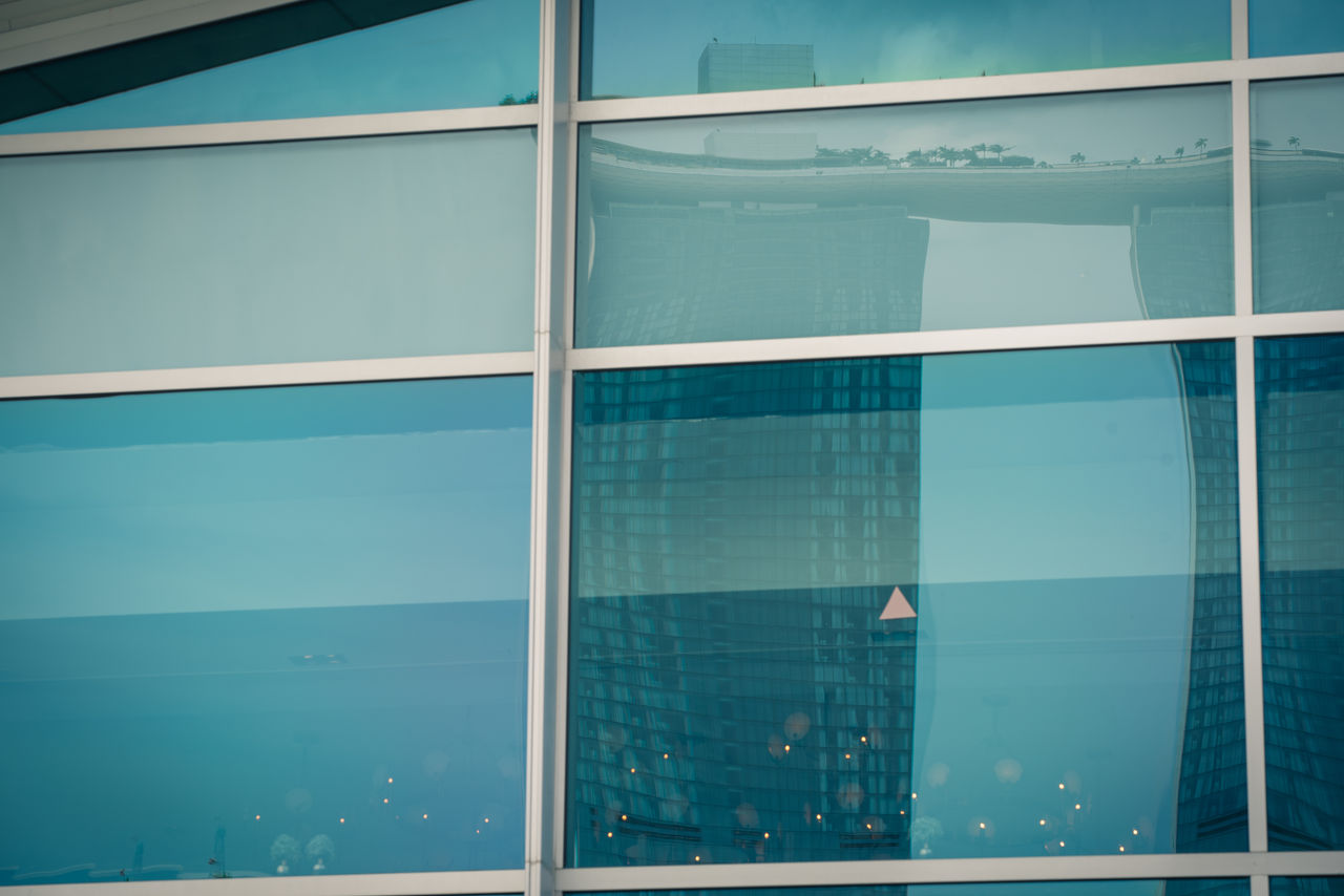 FULL FRAME SHOT OF SWIMMING POOL BY BUILDING