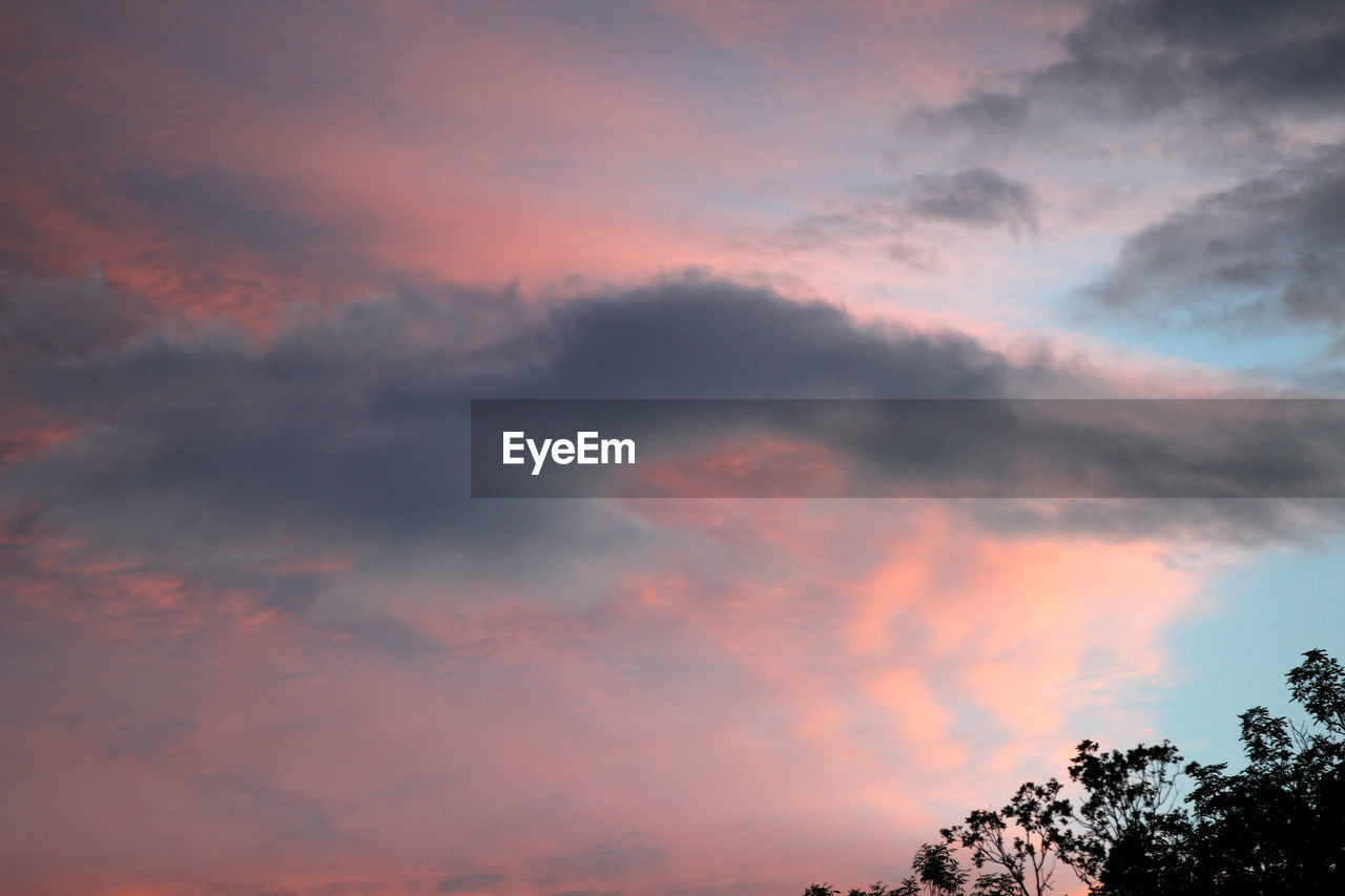 Low angle view of dramatic sky during sunset