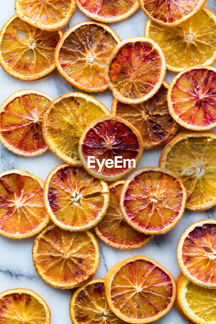 Top down view of various dried spiced orange slices.