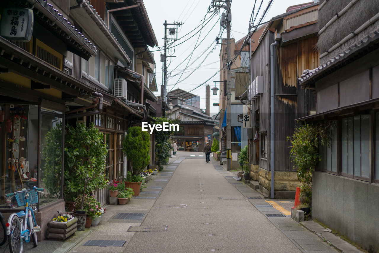 Street amidst buildings against sky