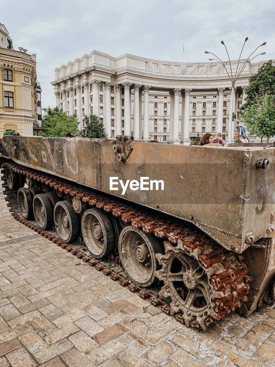 architecture, vehicle, transport, built structure, building exterior, transportation, city, mode of transportation, tank, street, sky, day, no people, land vehicle, history, military, nature, the past, outdoors, combat vehicle, building, travel, cloud