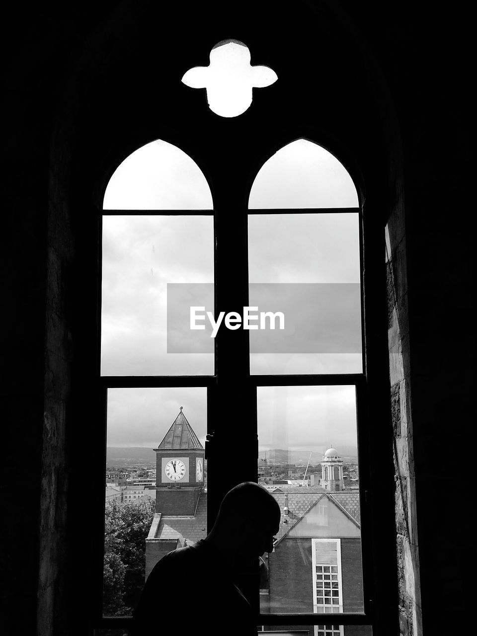 Man standing by window