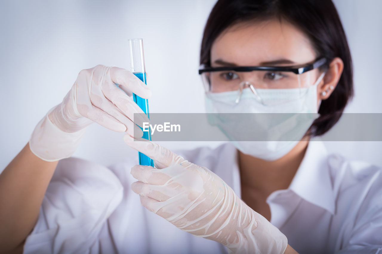 Female scientist holding medical sample at laboratory