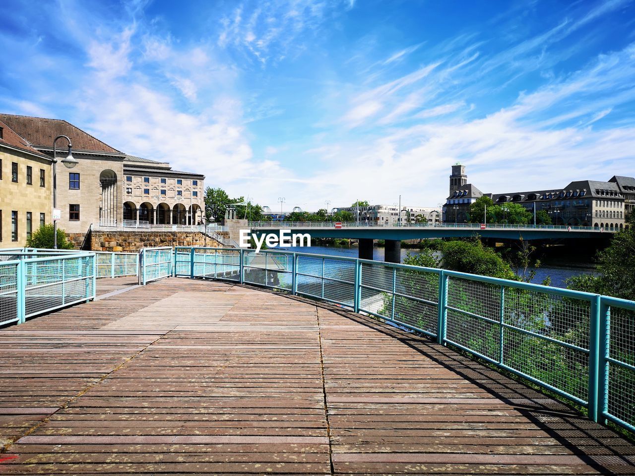 View of bridge over river against buildings