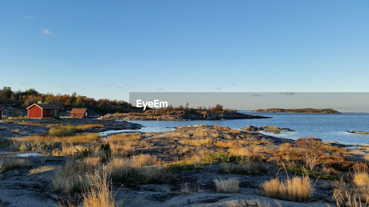 Scenic view of lake against blue sky