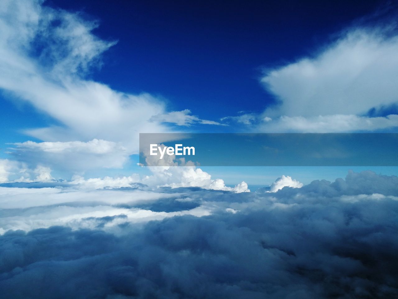 LOW ANGLE VIEW OF CLOUDS AGAINST BLUE SKY