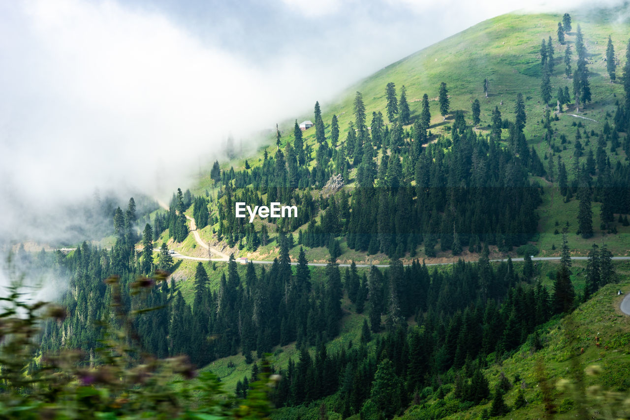 panoramic view of lake by mountains against sky