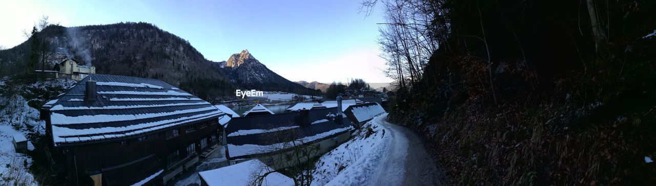 PANORAMIC SHOT OF FROZEN LAKE AGAINST SKY