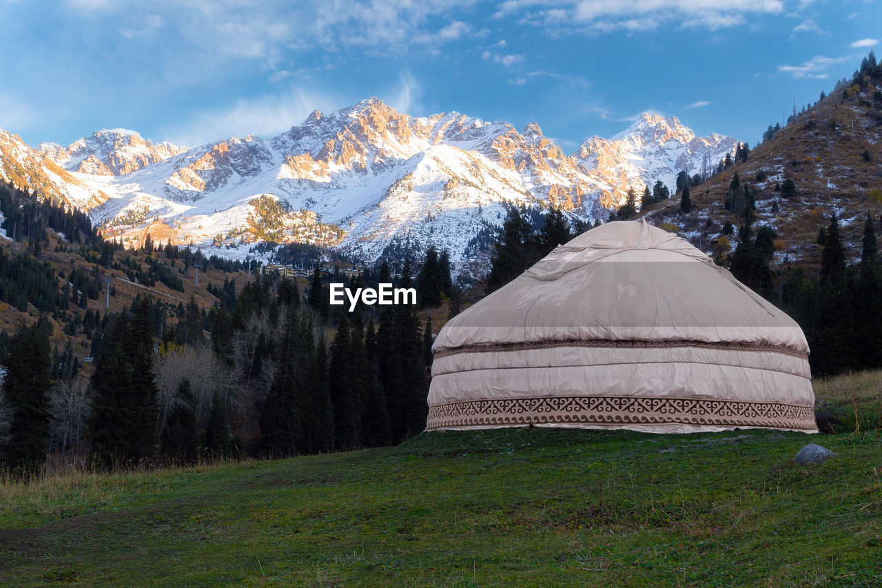 Scenic view of snowcapped mountains against sky during winter