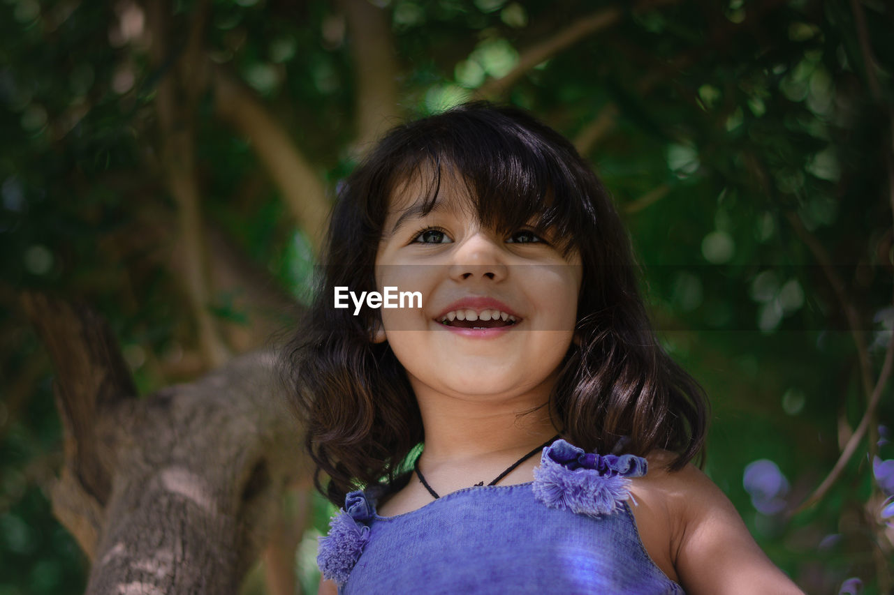 PORTRAIT OF GIRL SMILING