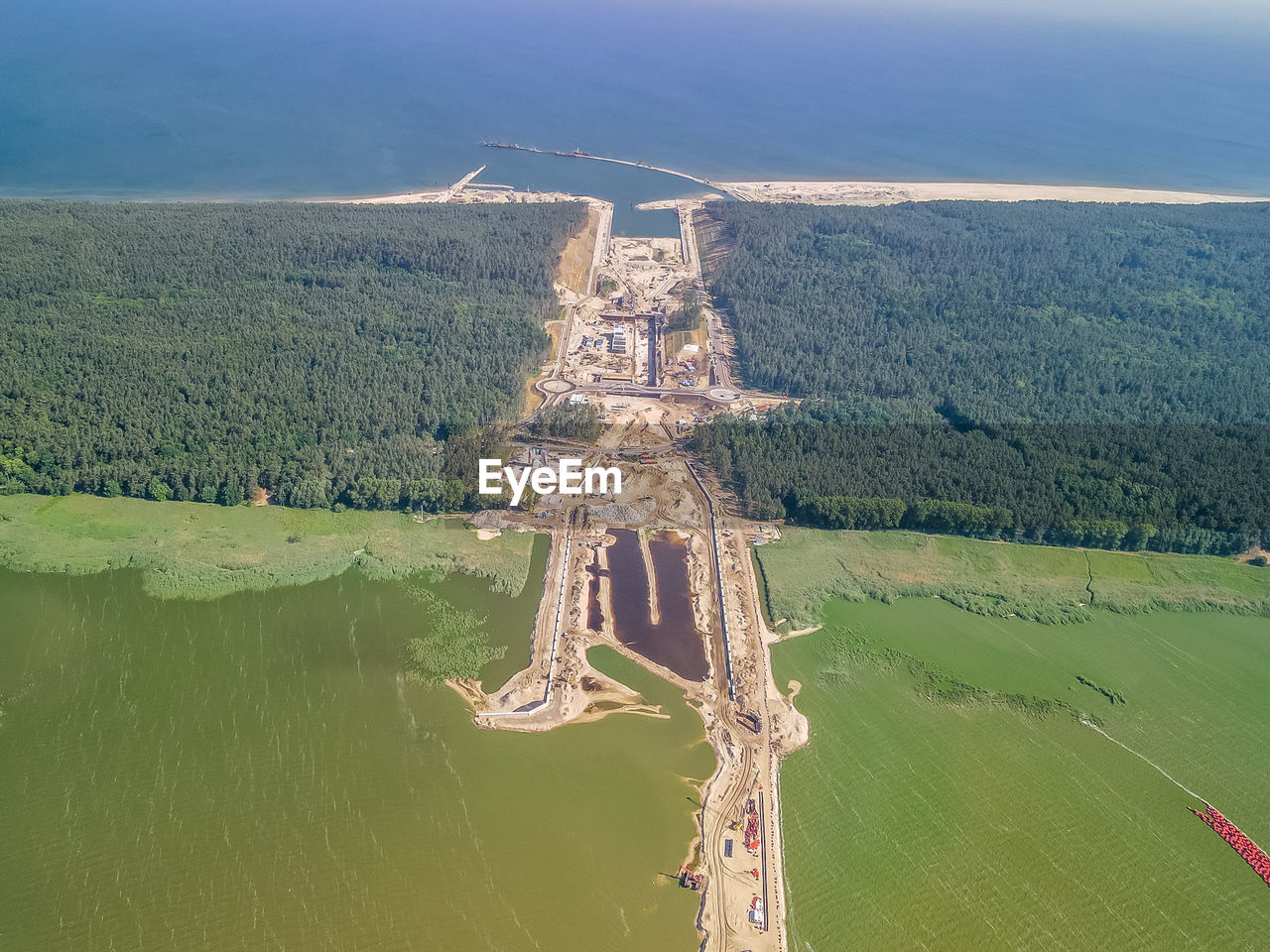 HIGH ANGLE VIEW OF WATER ON LANDSCAPE