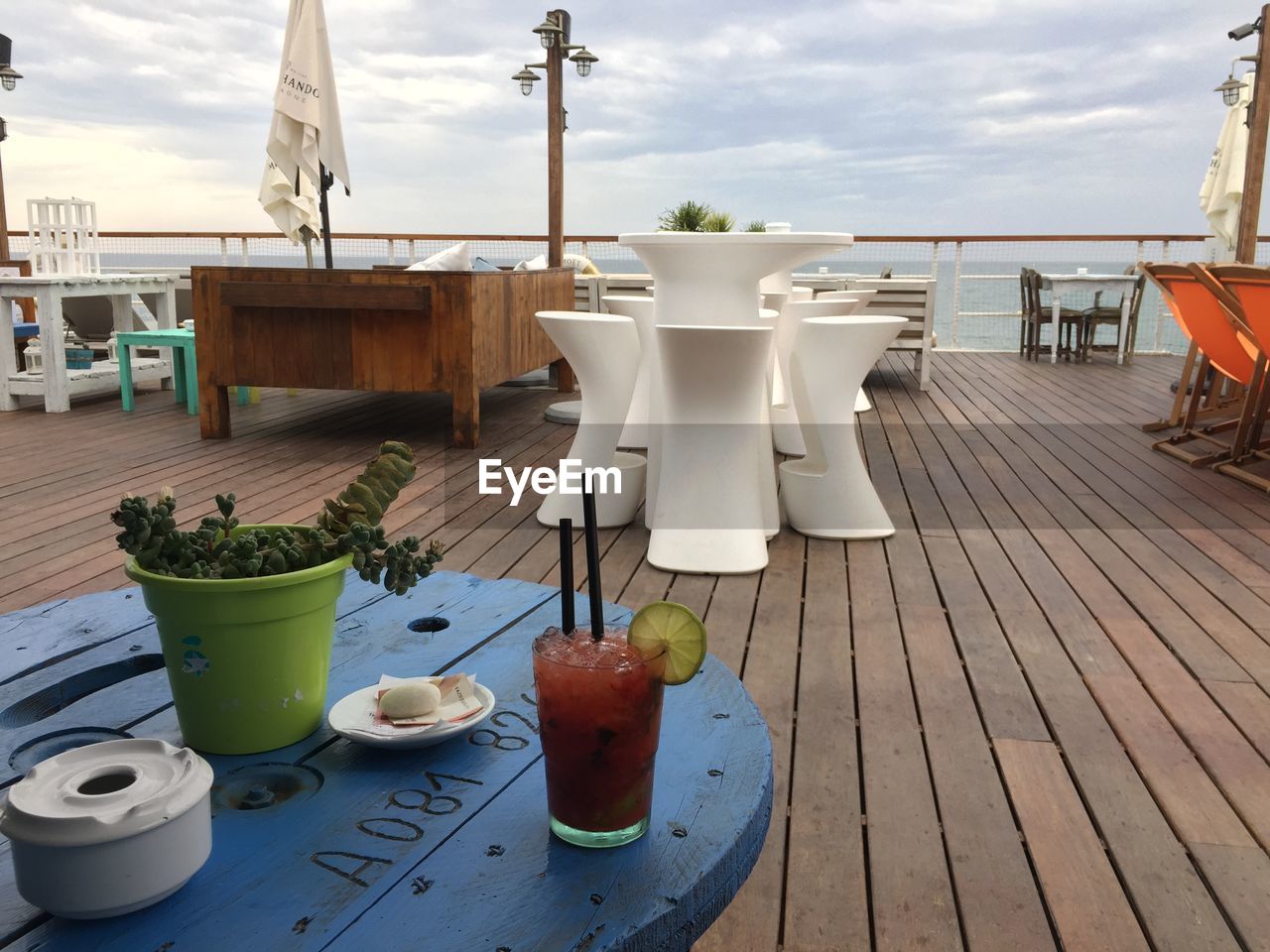 COFFEE CUPS ON TABLE AGAINST SKY