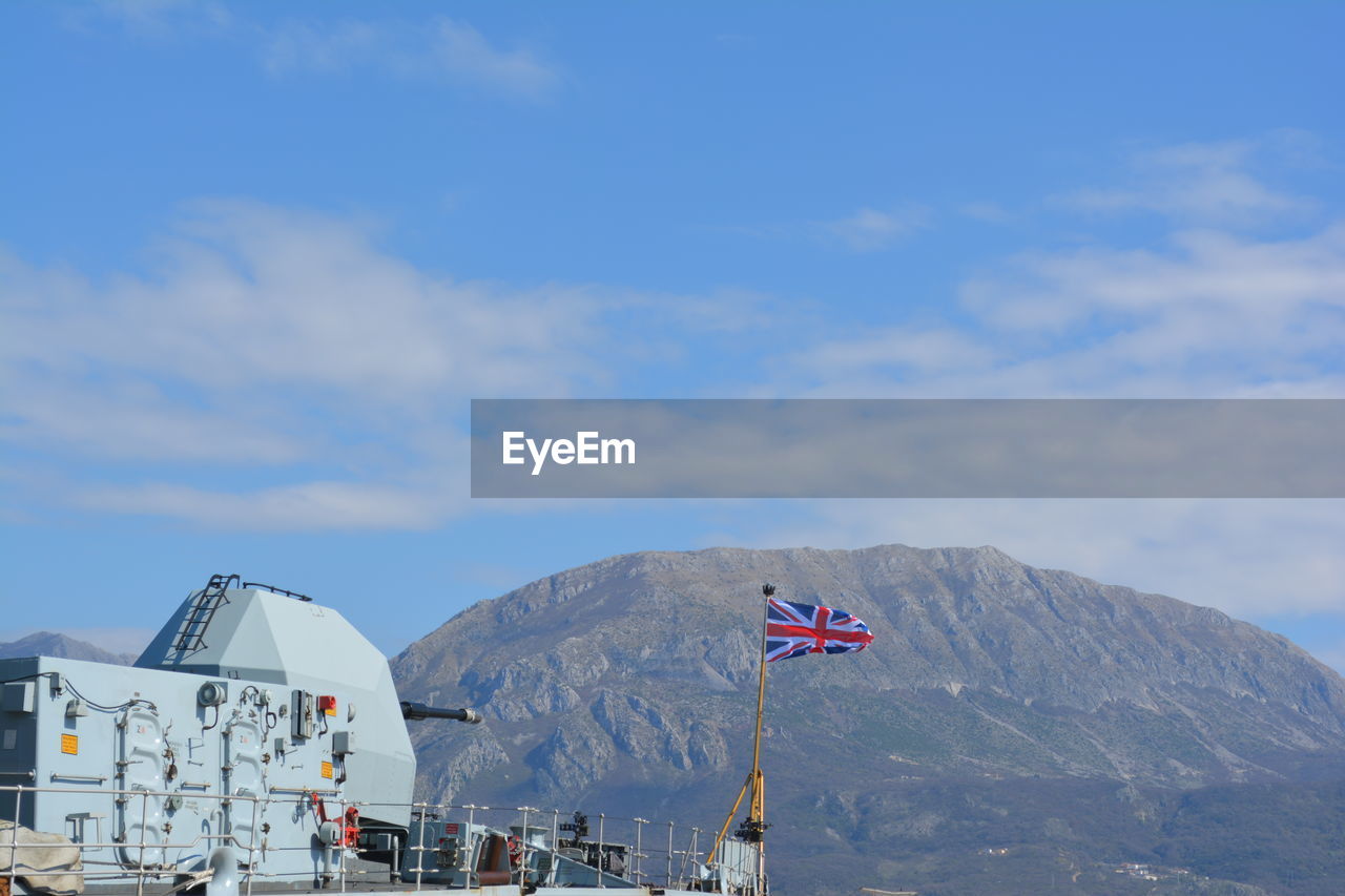 SCENIC VIEW OF FLAG AGAINST SKY