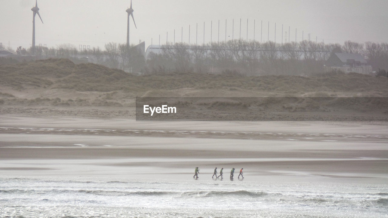 GROUP OF PEOPLE ON BEACH