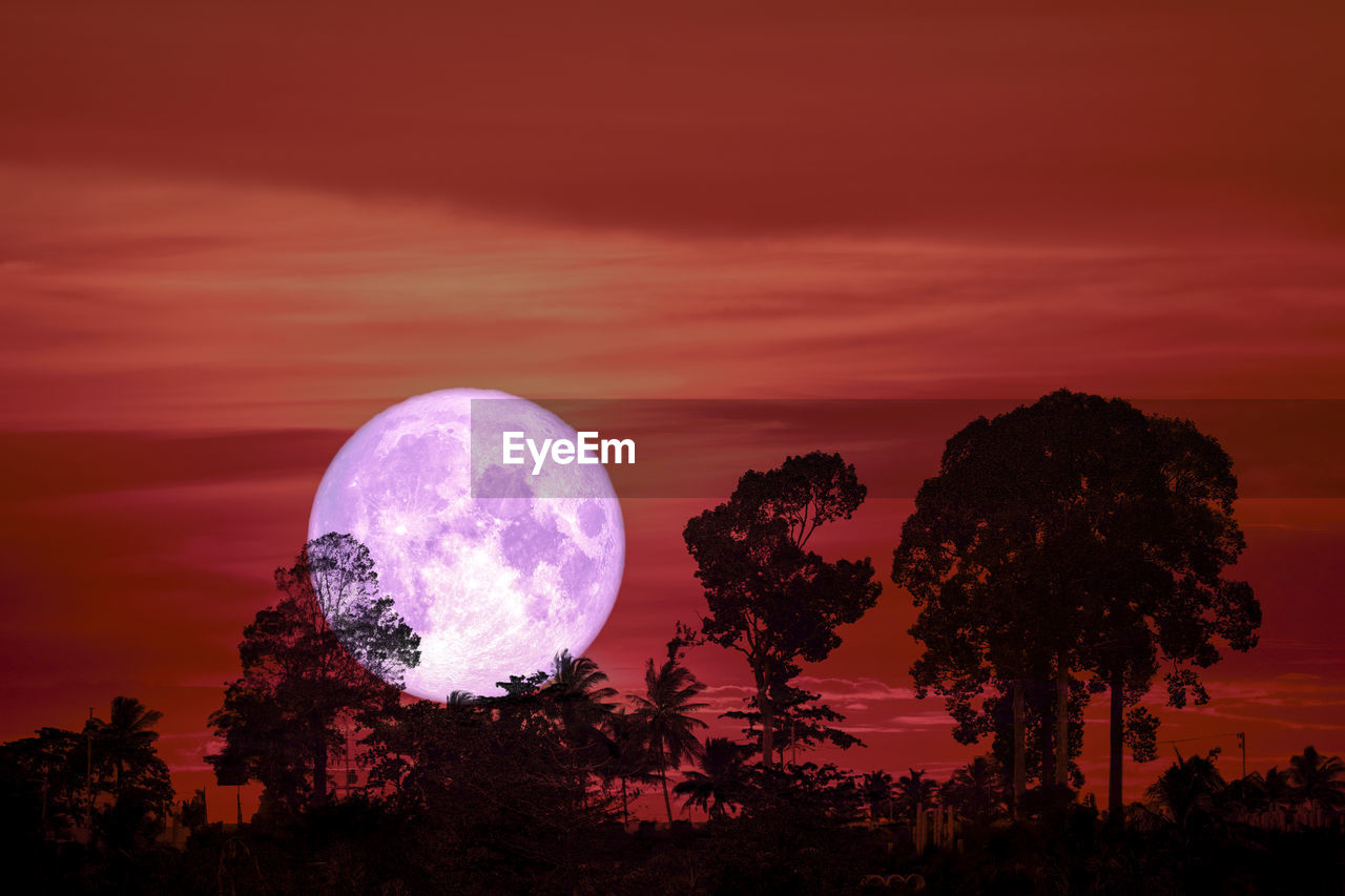 Scenic view of moon against sky at sunset