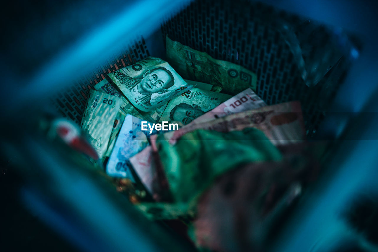 Close-up of currency in basket