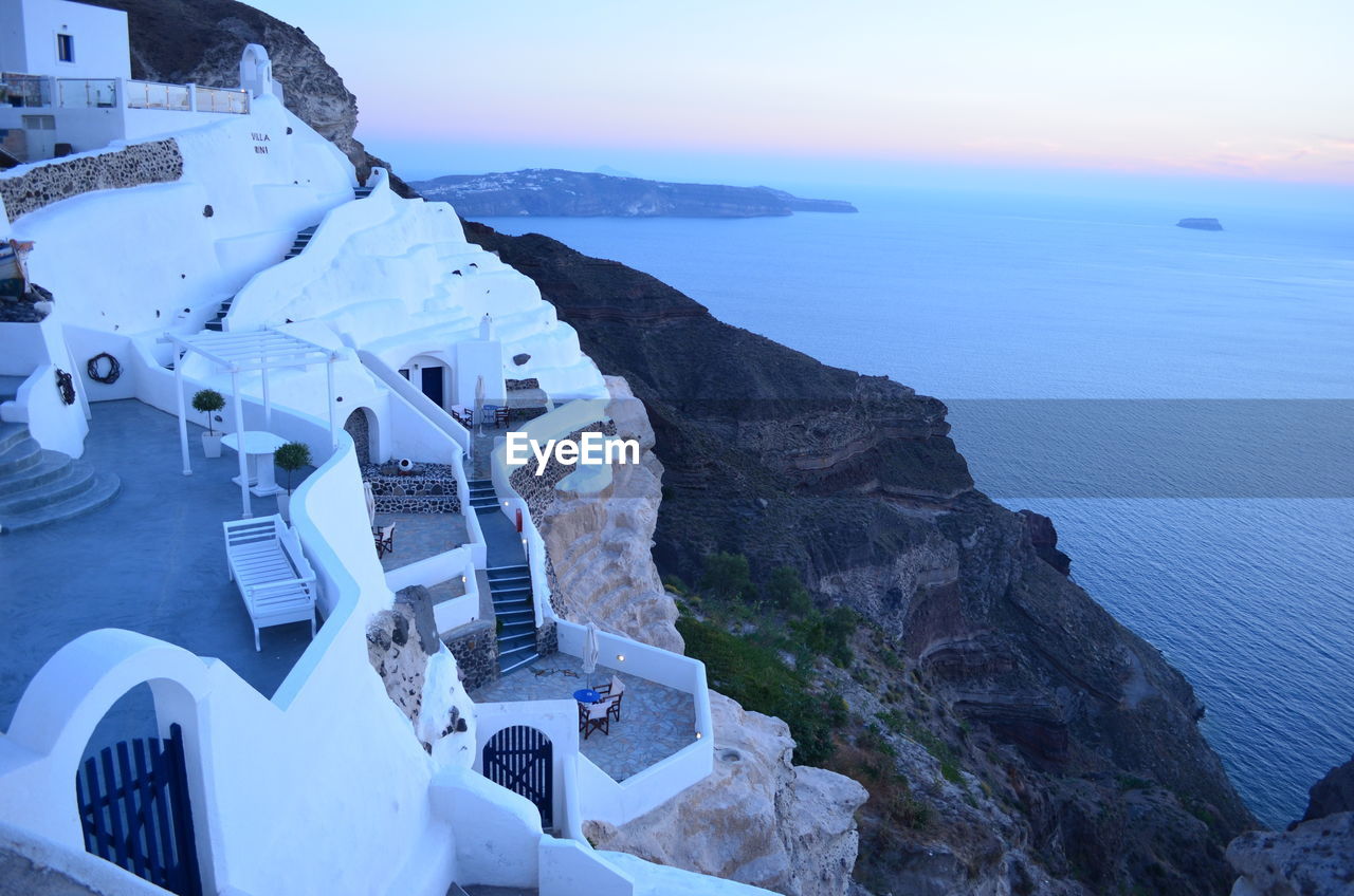 High angle view of whitewashed houses at santorini against aegean sea