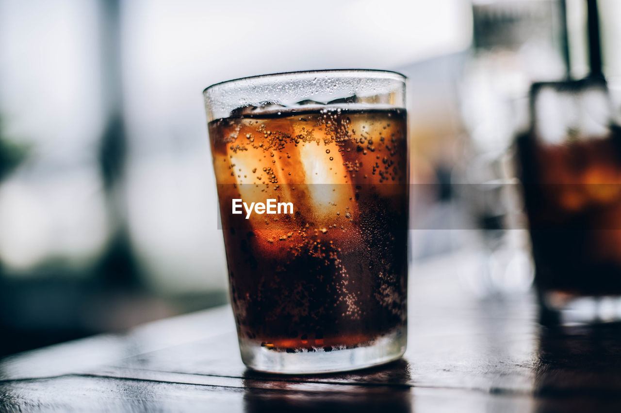 Close-up of beer glass on table