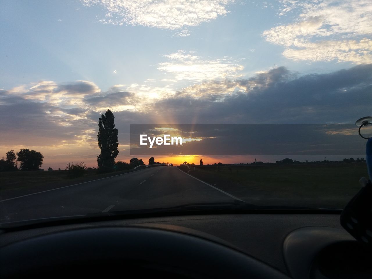 ROAD AGAINST SKY DURING SUNSET