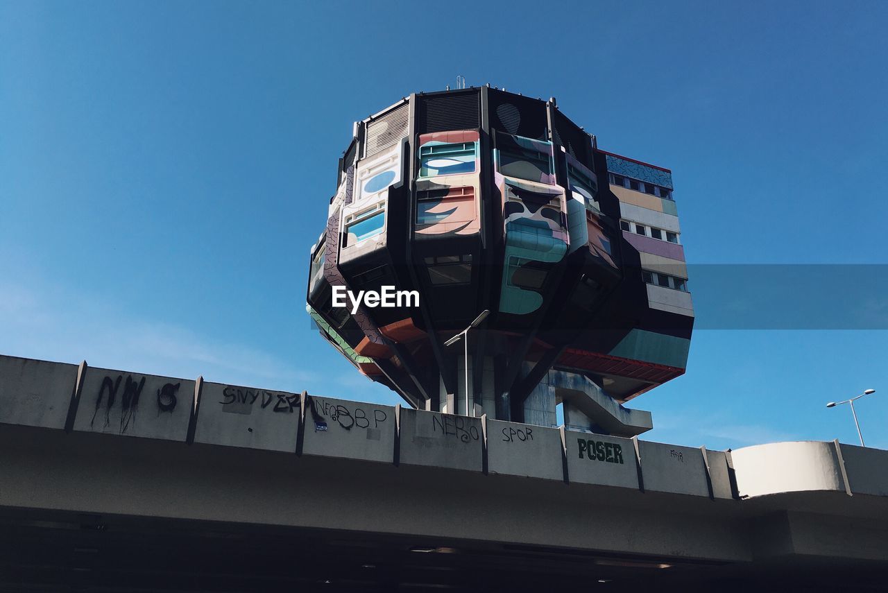 LOW ANGLE VIEW OF COMMUNICATIONS TOWER AGAINST SKY