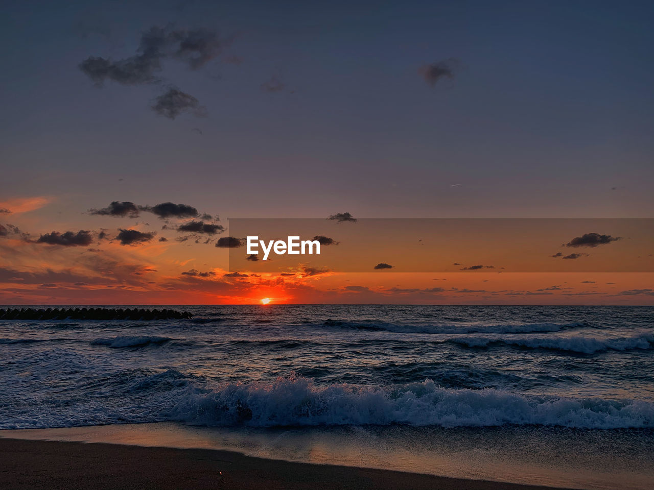 Scenic view of sea against sky during sunset