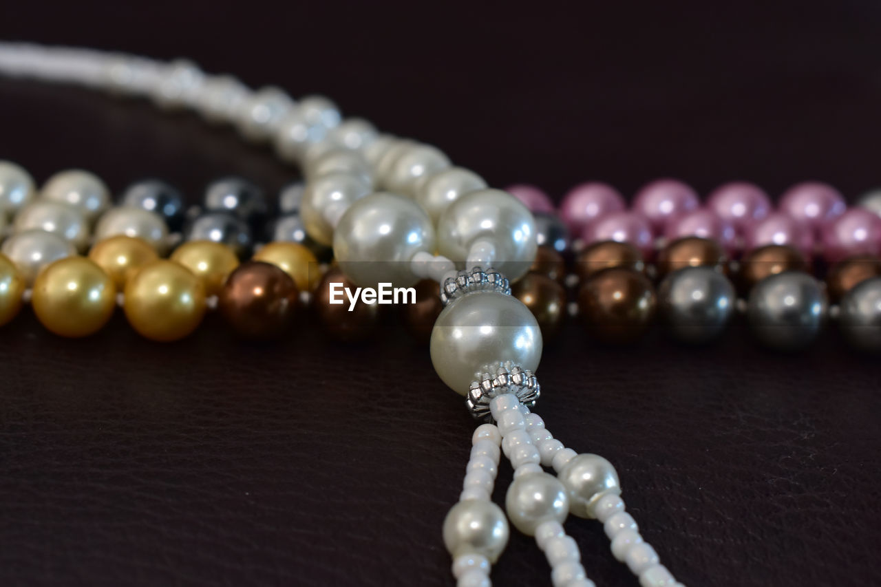 CLOSE-UP OF DECORATION ON TABLE WITH CANDLES