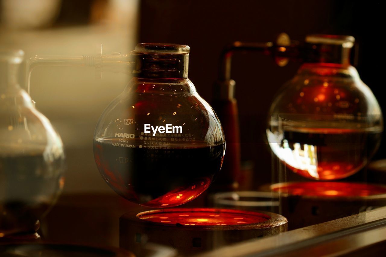 Close-up of coffee glass on table