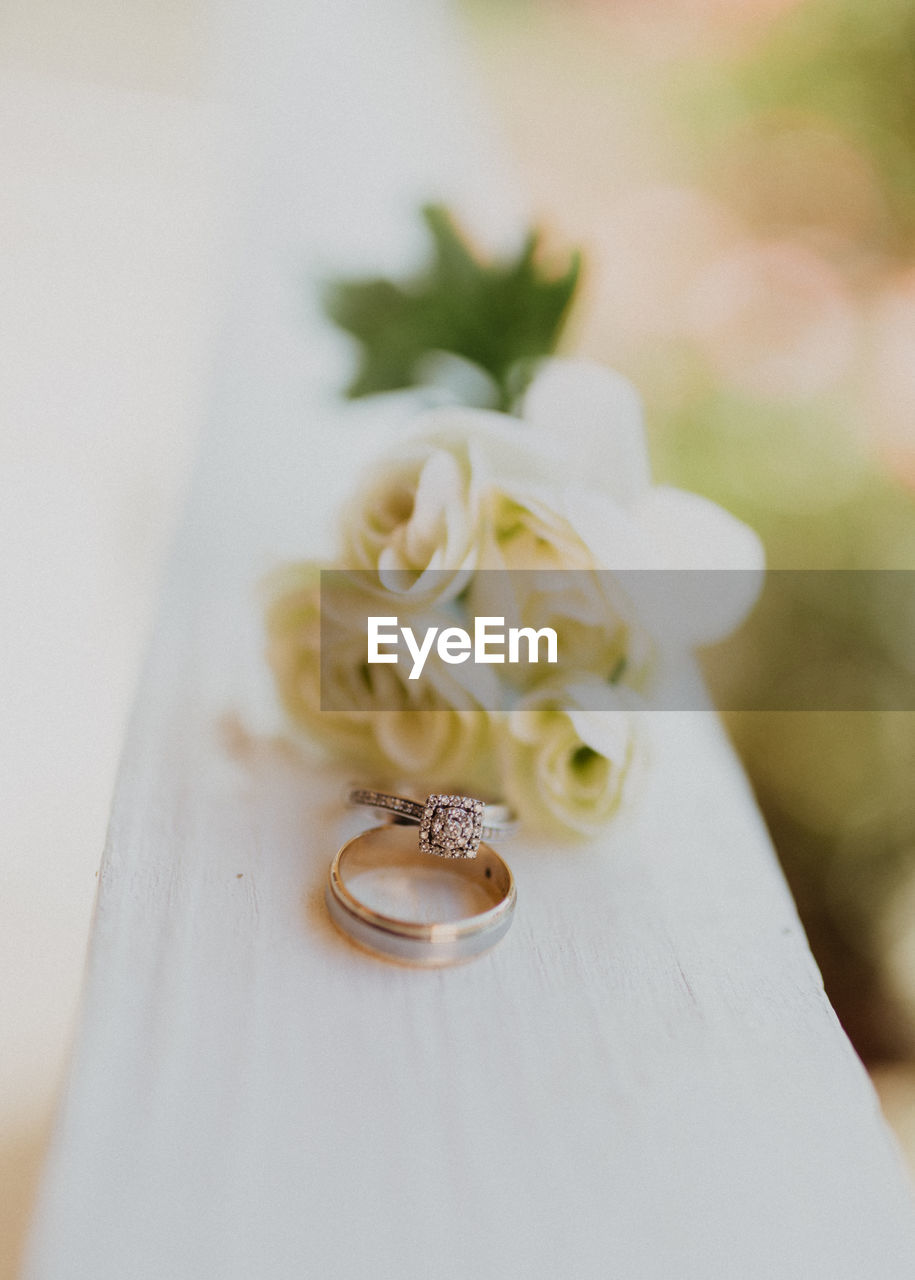 Close-up of wedding ring on table