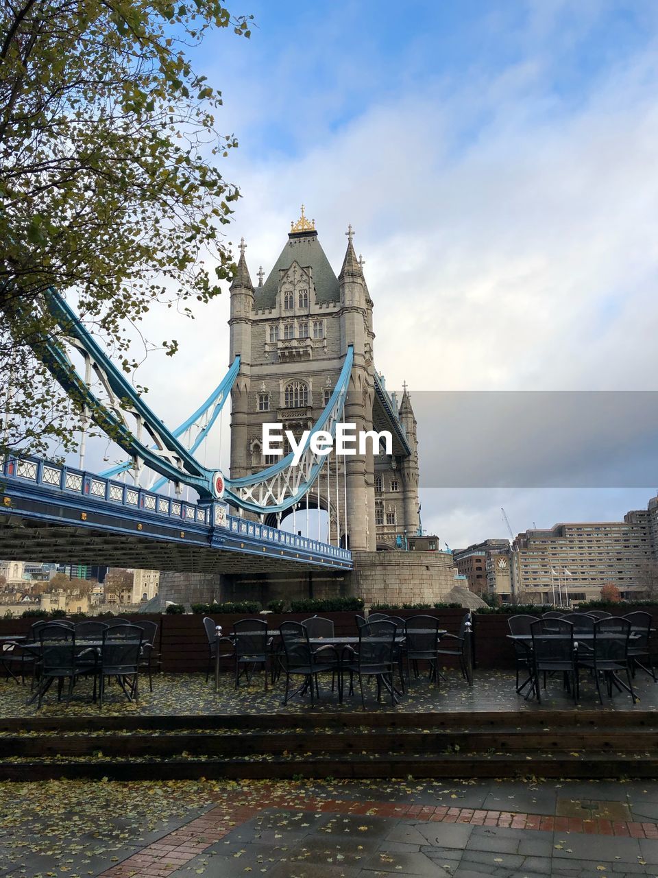 View of bridge over river against cloudy sky