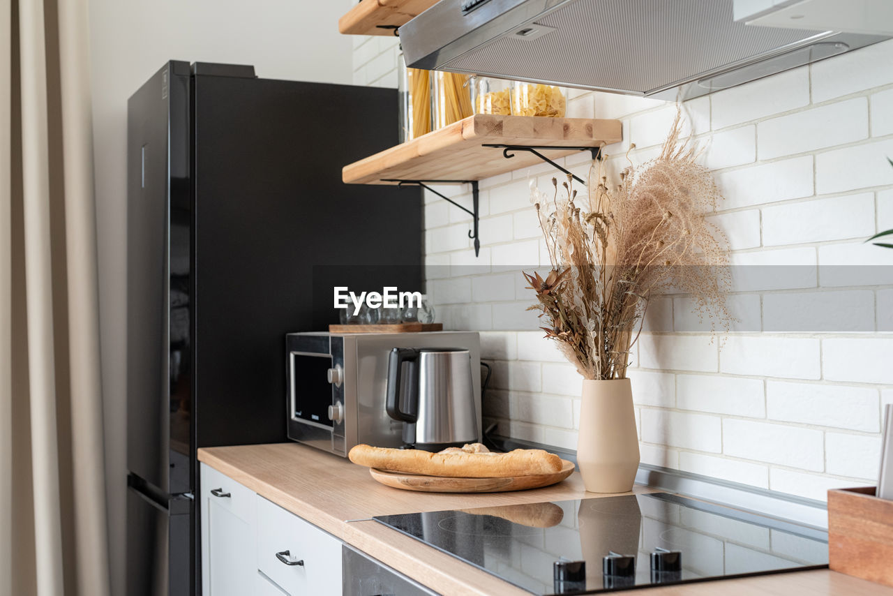 Interior of kitchen in rustic style with vintage kitchen ware and wooden wall