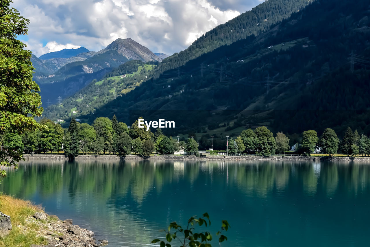 Scenic view of lake and mountains against sky