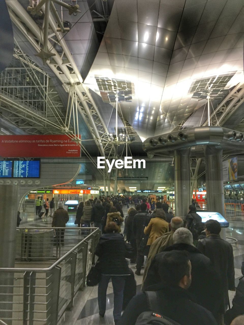 PEOPLE WAITING AT RAILROAD STATION