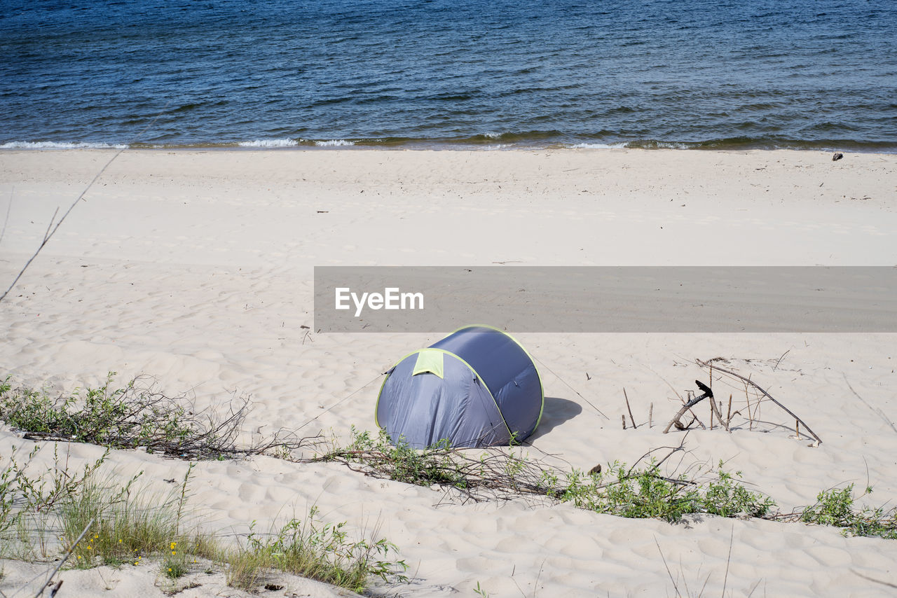 High angle view of tent on sand at beach